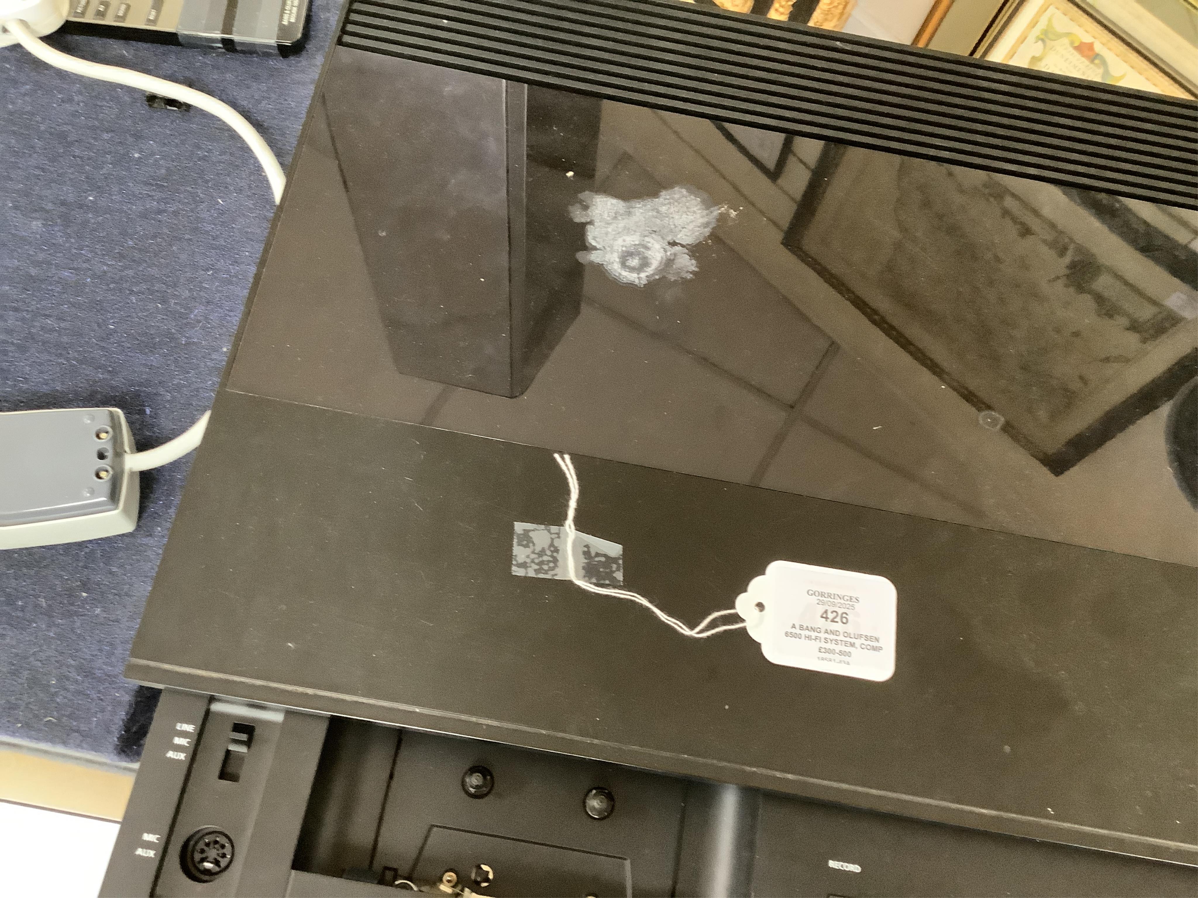 A Bang and Olufsen 6500 hi-fi system, comprising of a Beocord 6500, a Beogram CD 6500, a Beomaster 6500, and a master control panel, together with a pair of floor standing pedestal speakers, 164cm high, and pair of type